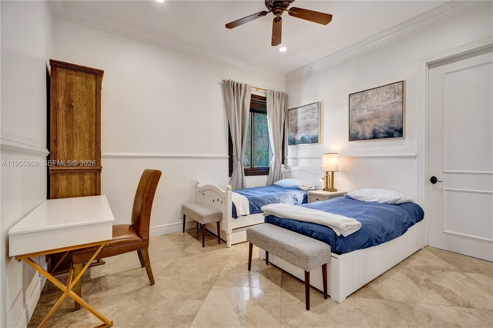 3175 Hunter Road Weston, FL 33331 - Photo 26 of 45 a living room with a bed furniture and paintings on the wall