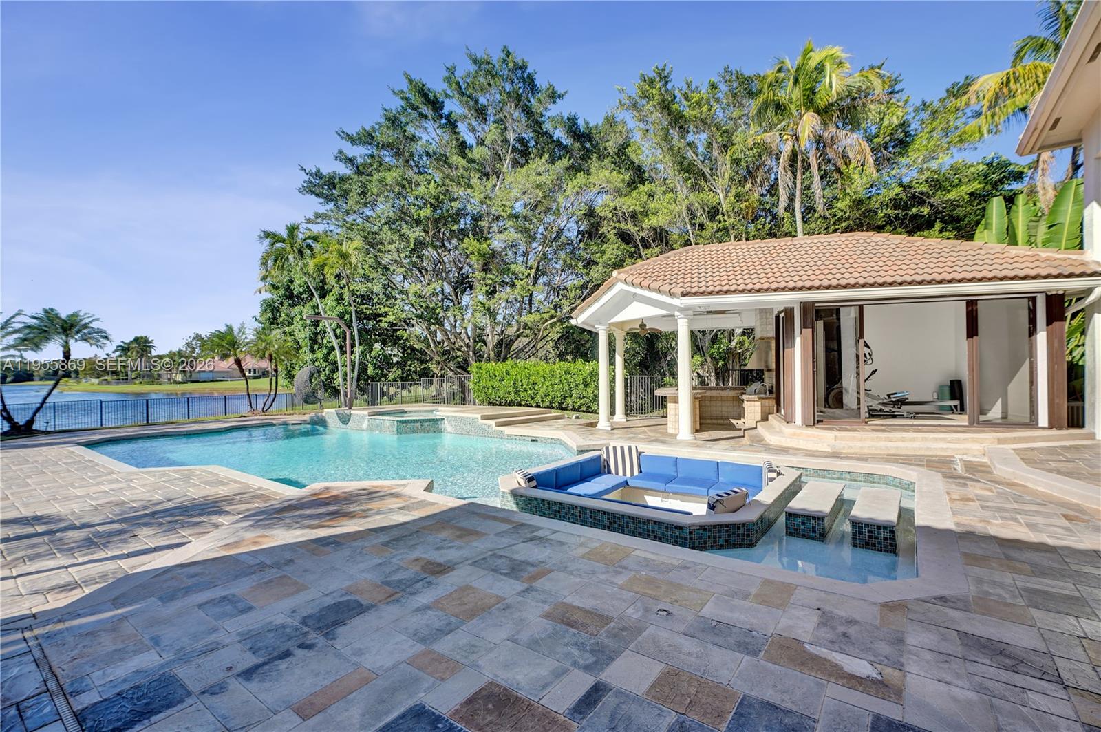 3175 Hunter Road Weston, FL 33331 - Photo 28 of 45 a view of house with yard and outdoor seating