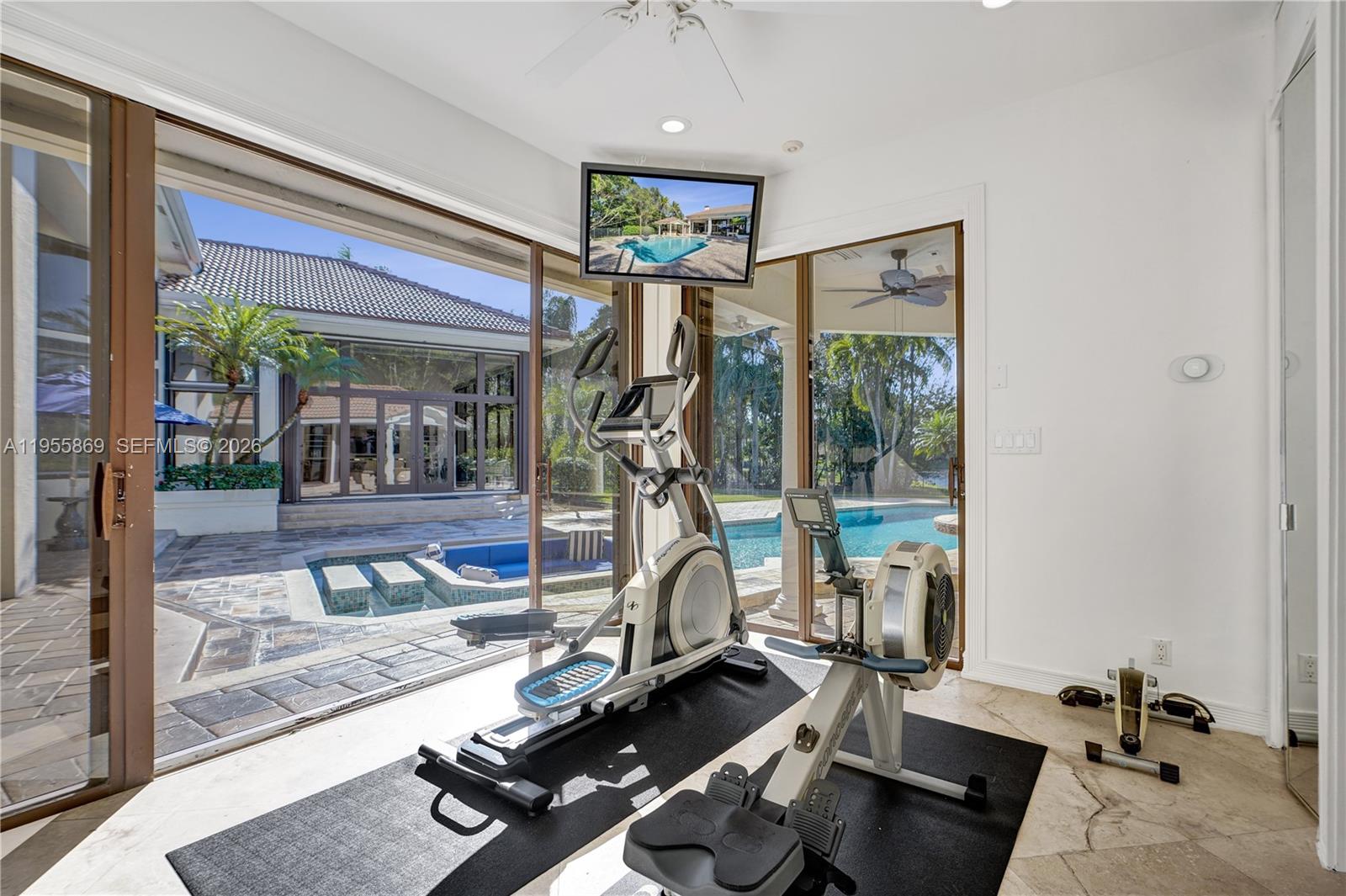 3175 Hunter Road Weston, FL 33331 - Photo 29 of 45 a view of a room with gym equipment