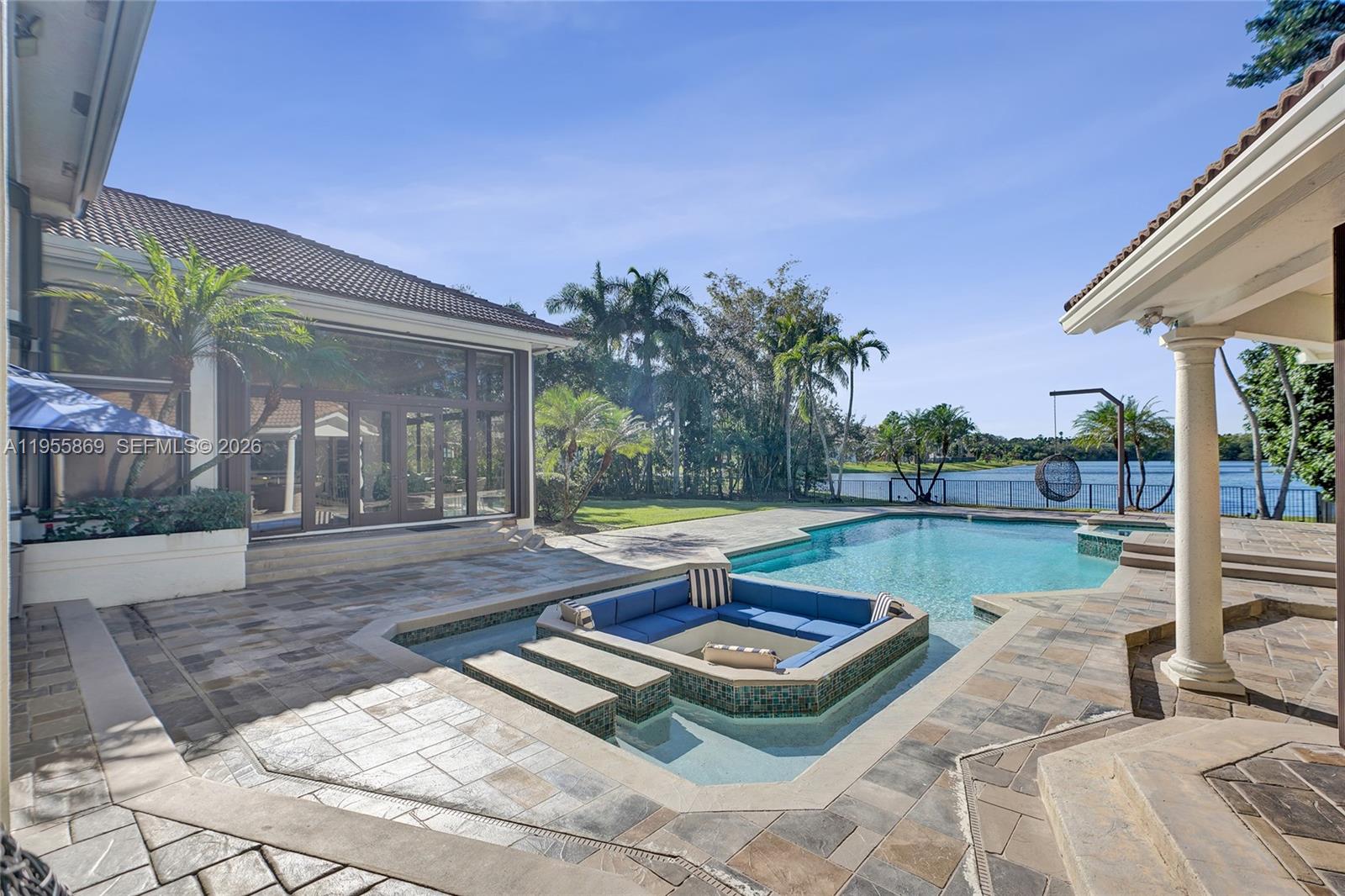 3175 Hunter Road Weston, FL 33331 - Photo 32 of 45 a view of a backyard with table and chairs potted plants
