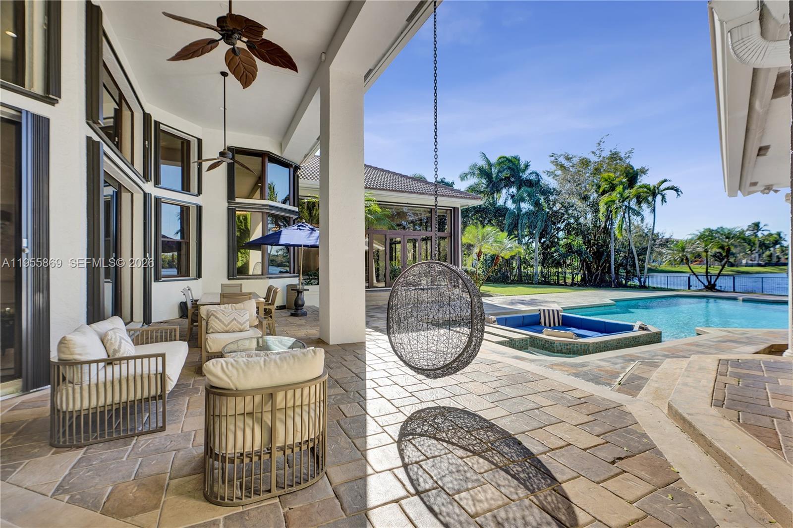 3175 Hunter Road Weston, FL 33331 - Photo 33 of 45 a view of a house with a swimming pool