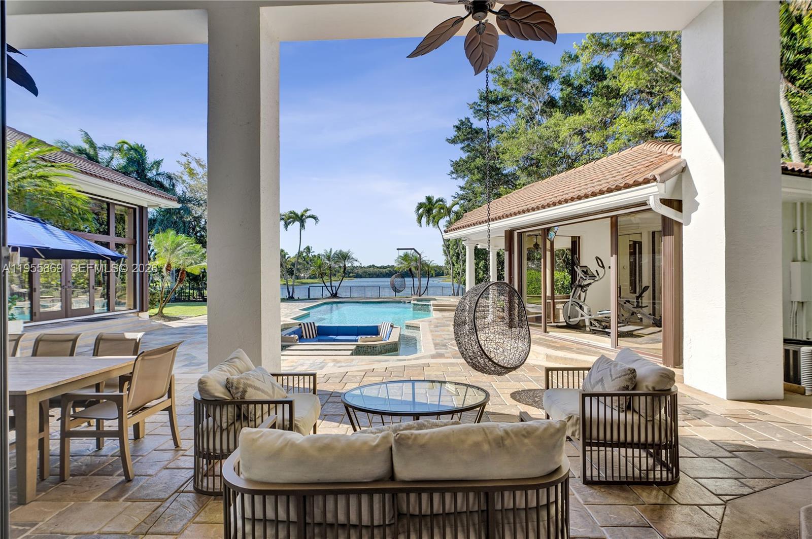3175 Hunter Road Weston, FL 33331 - Photo 34 of 45 a patio with table and chairs