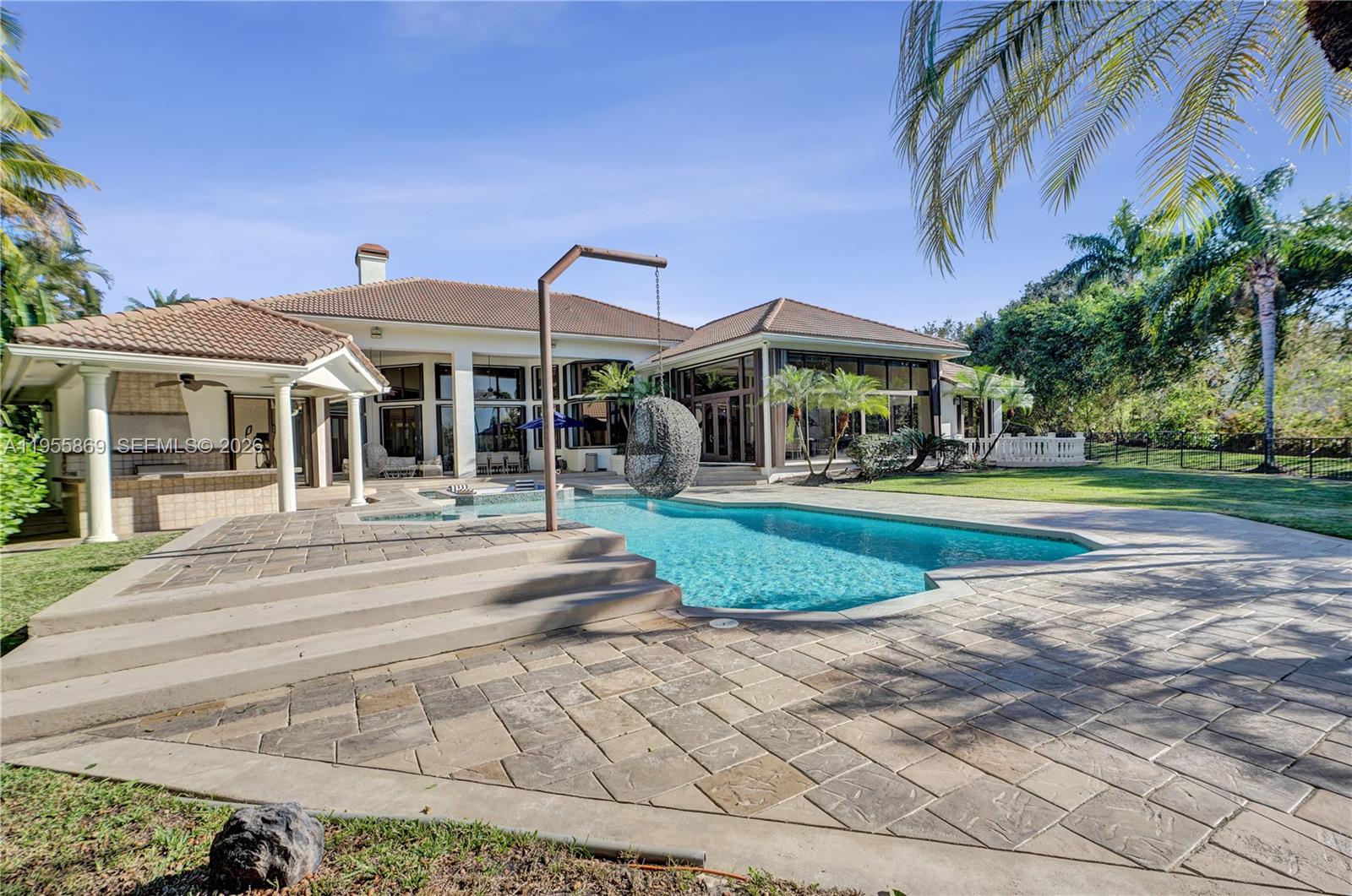 3175 Hunter Road Weston, FL 33331 - Photo 35 of 45 a view of a building with a yard