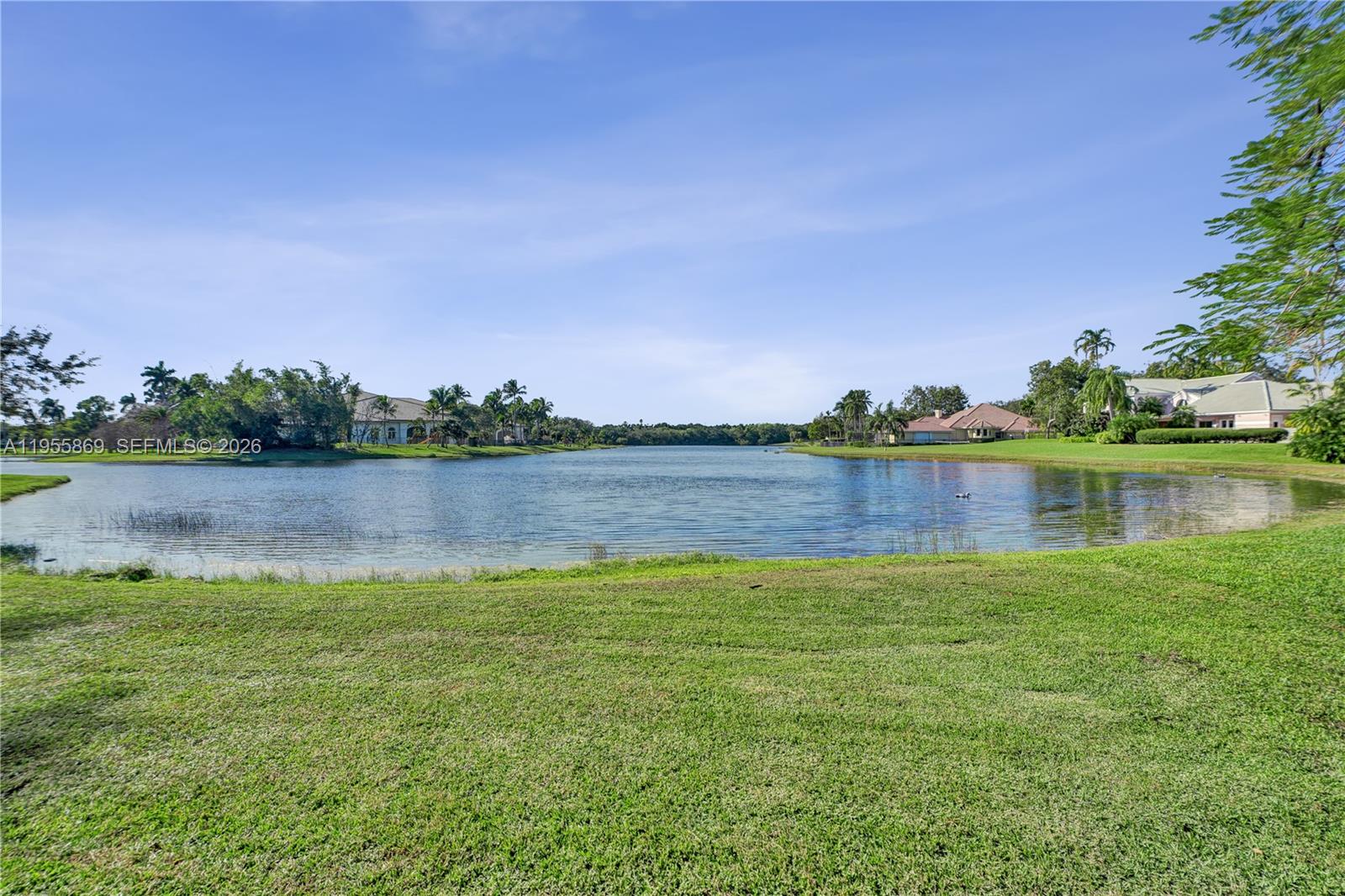 3175 Hunter Road Weston, FL 33331 - Photo 38 of 45 a view of a lake with houses in the back