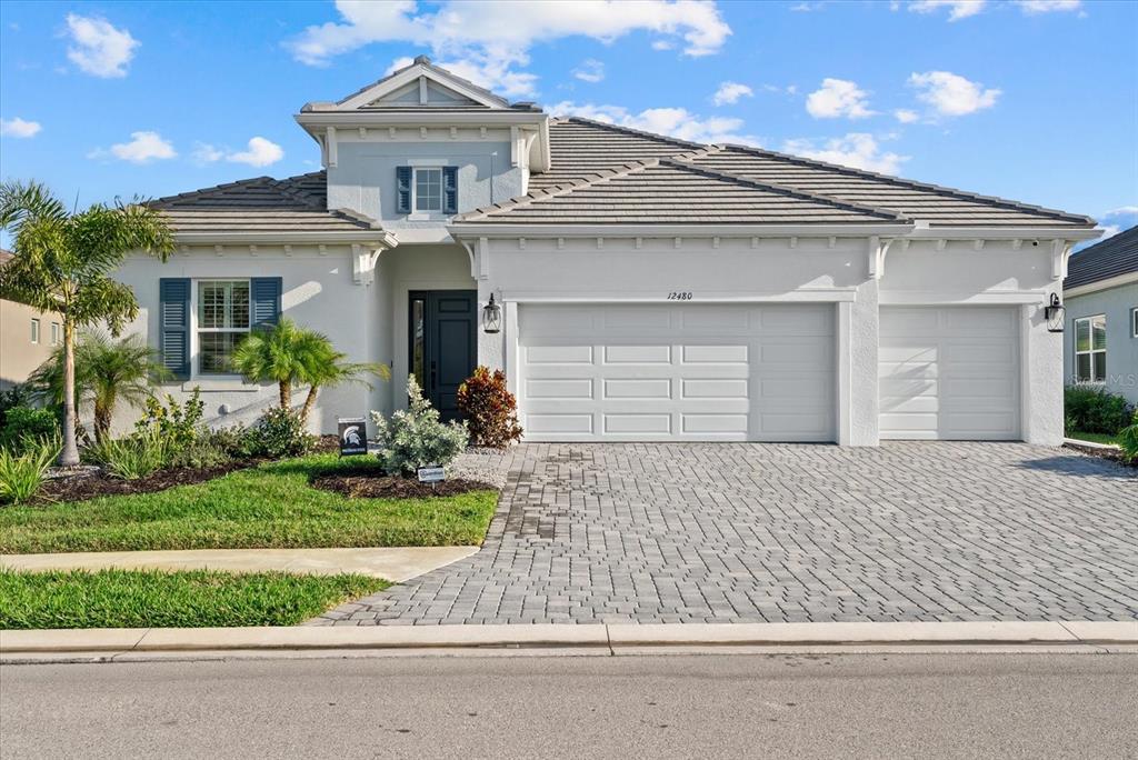 12480 Meribel Street Venice, FL 34293 - Photo 1 of 24 front view of a house with a yard