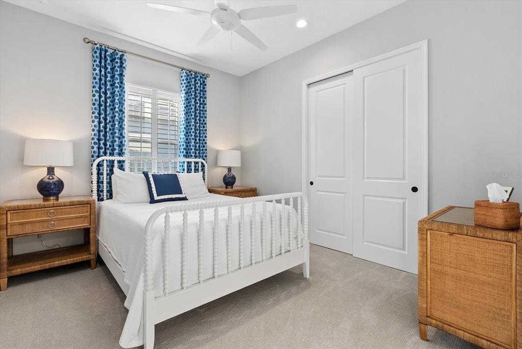 12480 Meribel Street Venice, FL 34293 - Photo 13 of 24 a bedroom with a bed and window