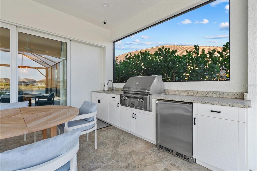 12480 Meribel Street Venice, FL 34293 - Photo 18 of 24 a room with a bed and a large window