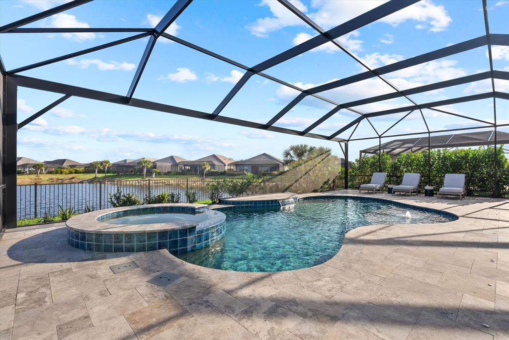 12480 Meribel Street Venice, FL 34293 - Photo 19 of 24 a view of a swimming pool with a yard