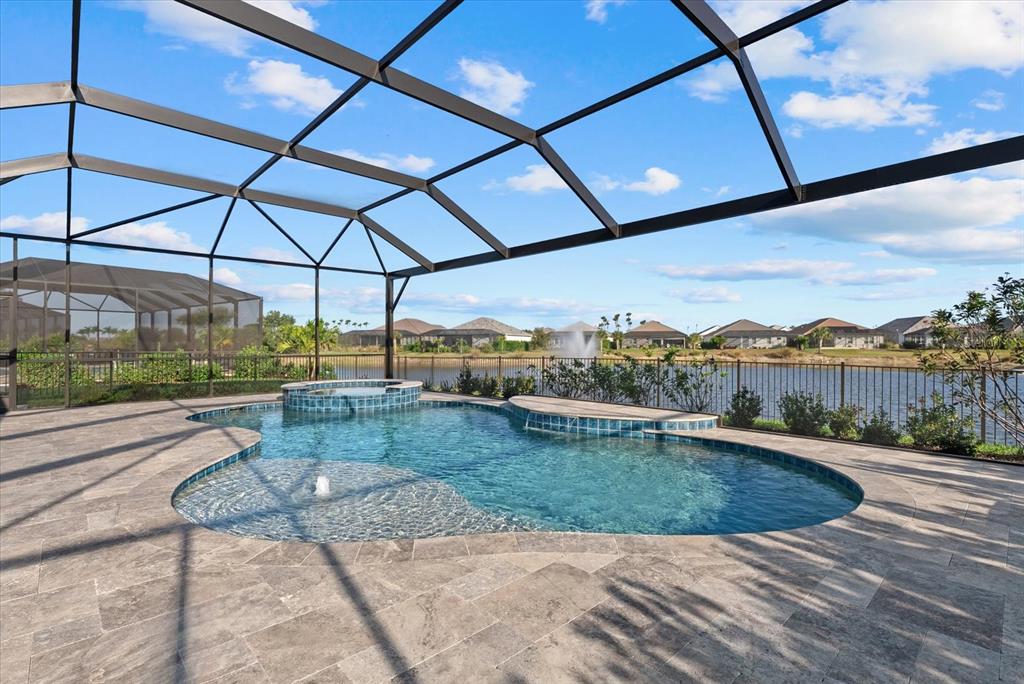 12480 Meribel Street Venice, FL 34293 - Photo 20 of 24 a view of a swimming pool with a porch