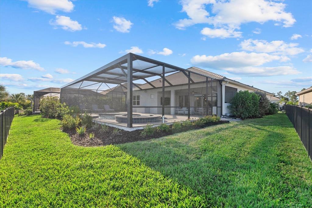 12480 Meribel Street Venice, FL 34293 - Photo 21 of 24 a view of a big yard next to a yard