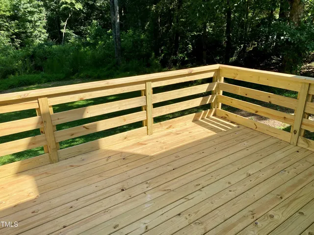 a view of outdoor space with deck and garden