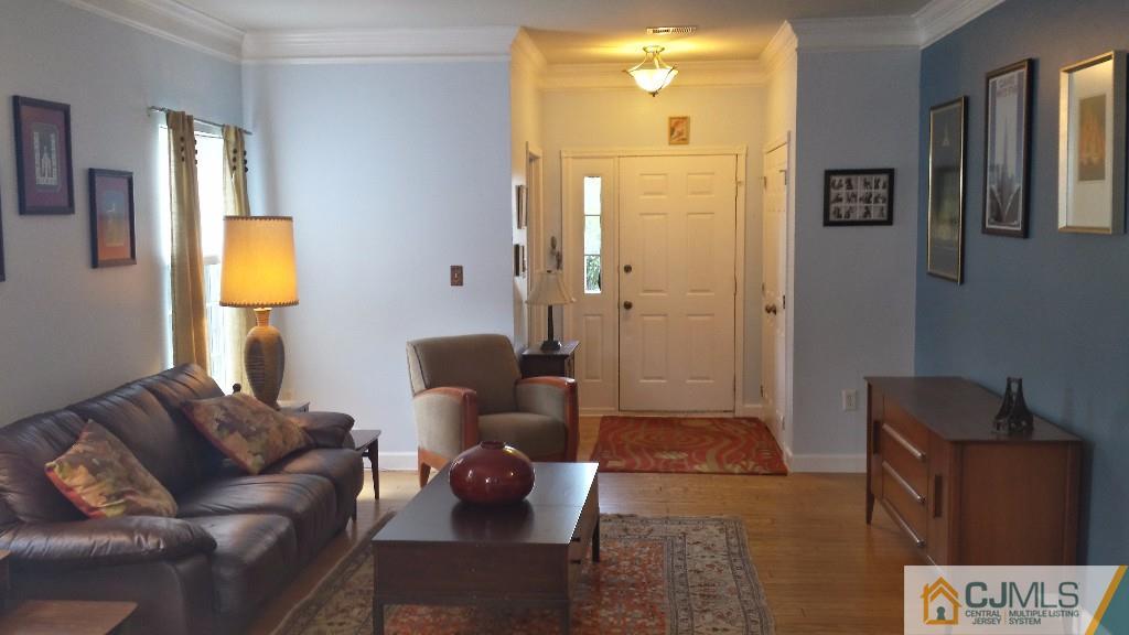 2 Brownstone Road East Windsor, NJ 08520 - Photo 2 of 18 a living room with furniture and a window