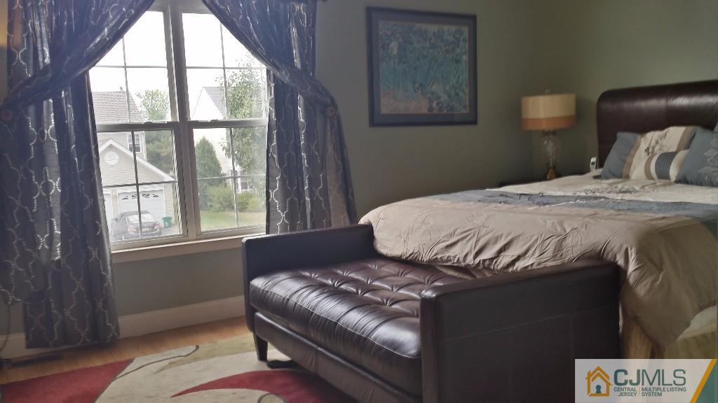 2 Brownstone Road East Windsor, NJ 08520 - Photo 13 of 18 a bedroom with a bed and window