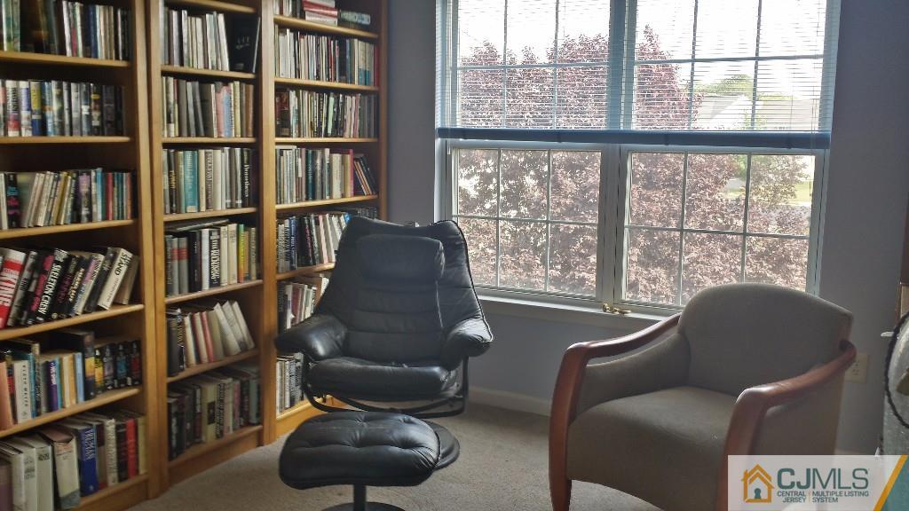 2 Brownstone Road East Windsor, NJ 08520 - Photo 14 of 18 a living room with furniture lots of books and a large window