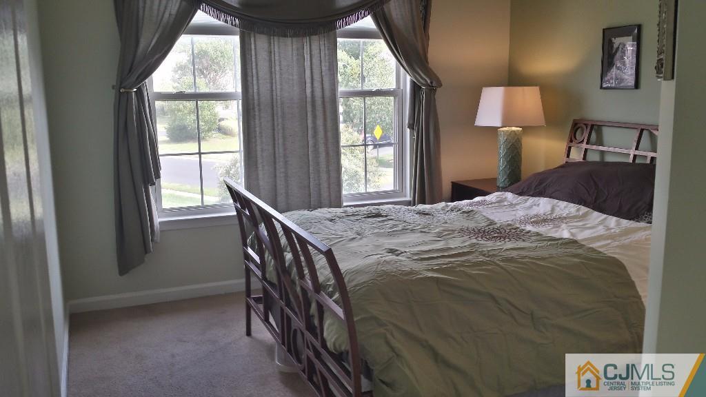 2 Brownstone Road East Windsor, NJ 08520 - Photo 15 of 18 a bedroom with a bed and a window