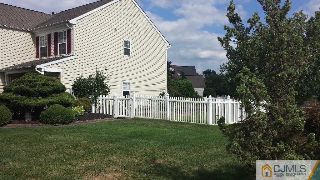 2 Brownstone Road East Windsor, NJ 08520 - Photo 17 of 18 a view of a house with a small yard and a garden