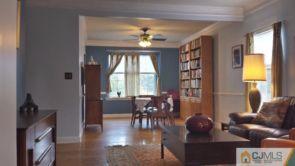 2 Brownstone Road East Windsor, NJ 08520 - Photo 3 of 18 a living room with furniture and a large window