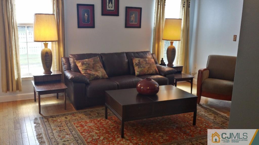 2 Brownstone Road East Windsor, NJ 08520 - Photo 4 of 18 a living room with furniture and a window