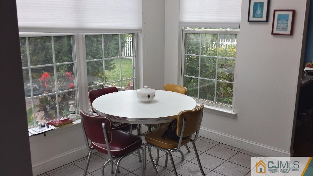 2 Brownstone Road East Windsor, NJ 08520 - Photo 8 of 18 a view of a dining room with furniture window and outside view