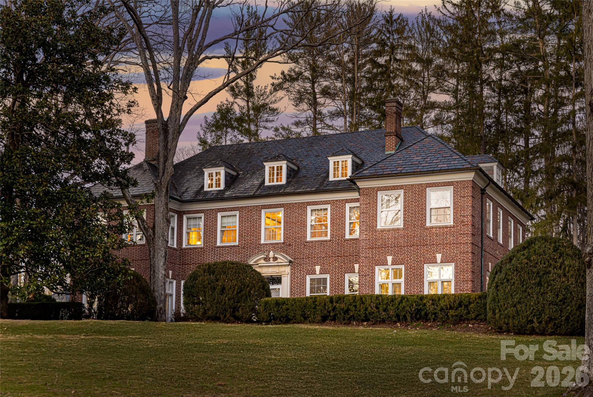 407 Vanderbilt Road Asheville, NC 28803 - Photo 2 of 48 a front view of a house with a garden