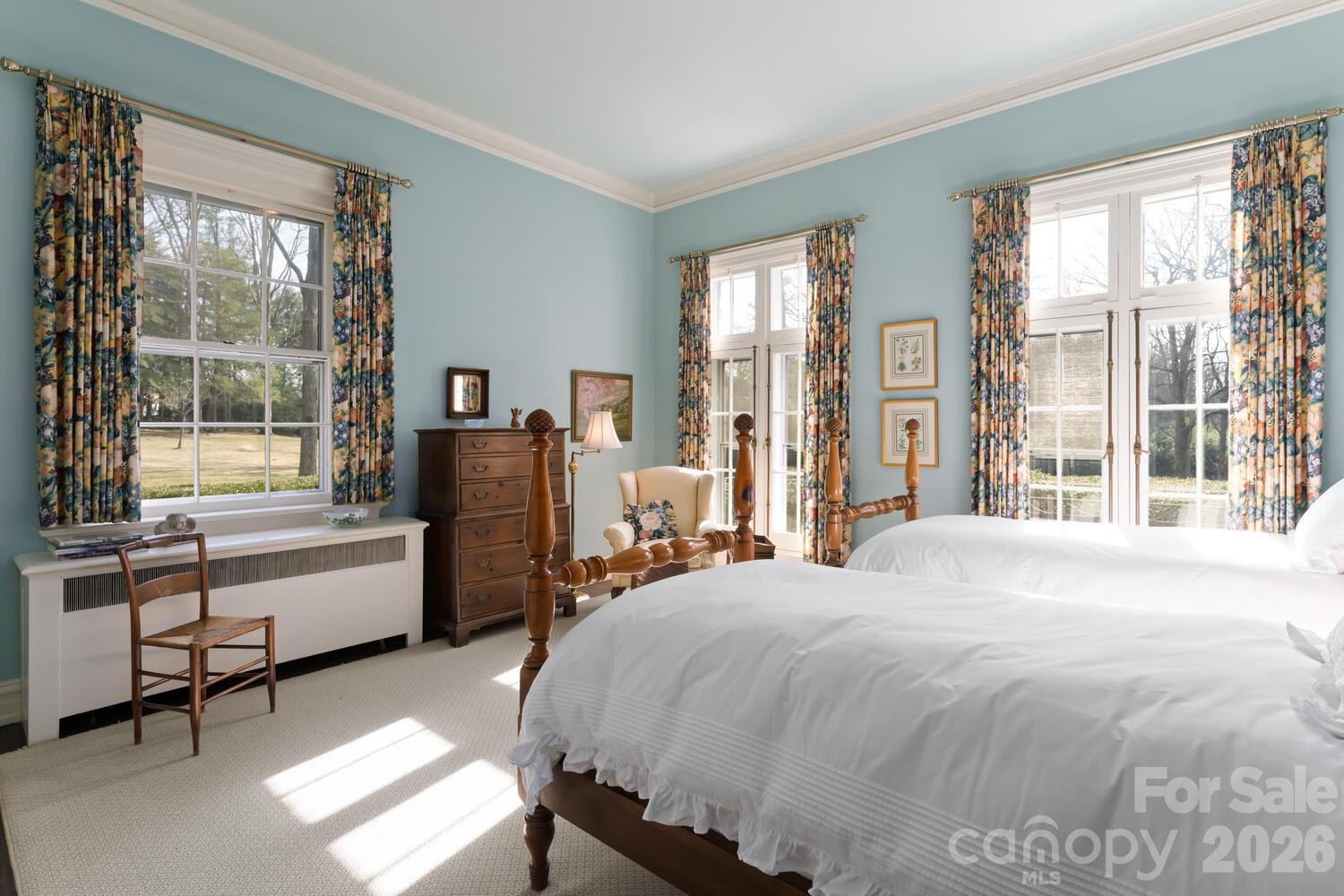 407 Vanderbilt Road Asheville, NC 28803 - Photo 27 of 48 a bedroom with a bed and a large window