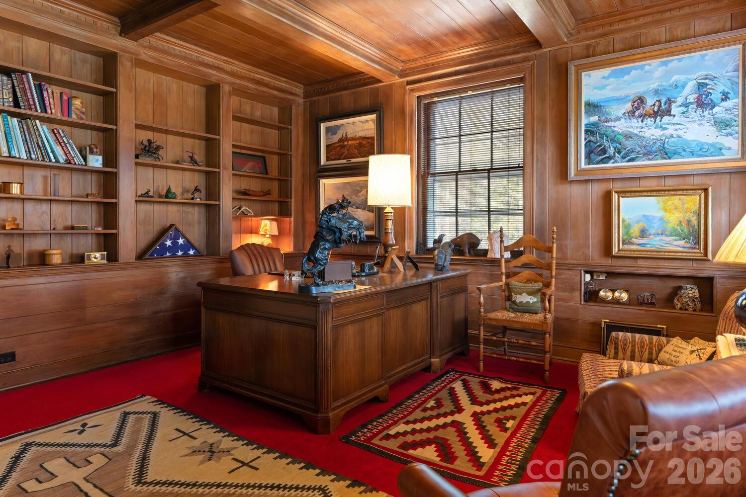 407 Vanderbilt Road Asheville, NC 28803 - Photo 37 of 48 a living room with furniture a bookshelf and a window