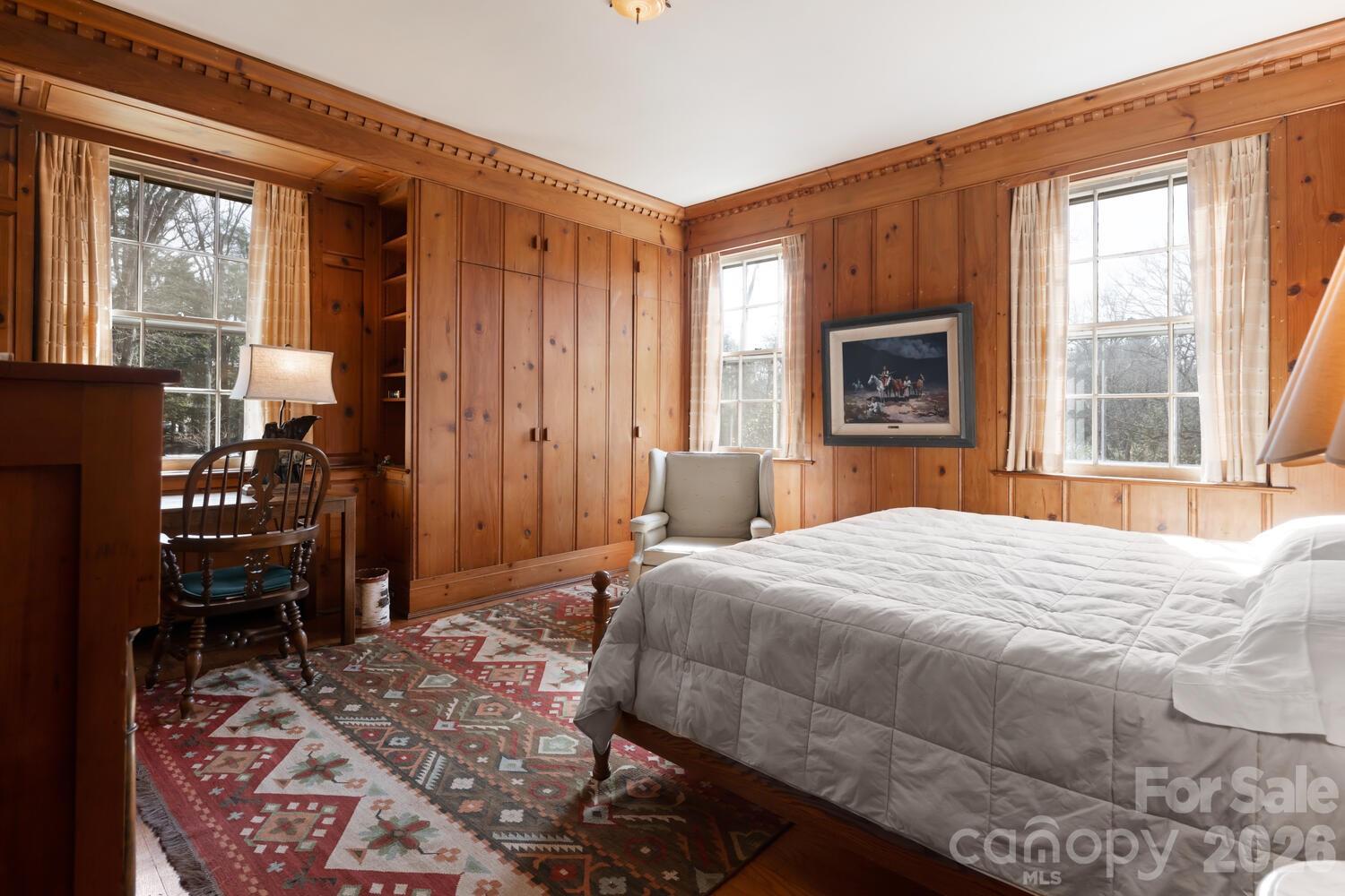 407 Vanderbilt Road Asheville, NC 28803 - Photo 41 of 48 a bedroom with a bed dresser and a window