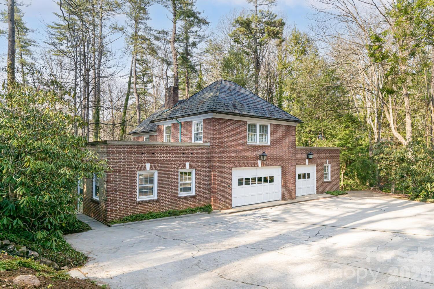 407 Vanderbilt Road Asheville, NC 28803 - Photo 46 of 48 a front view of a house with a tree