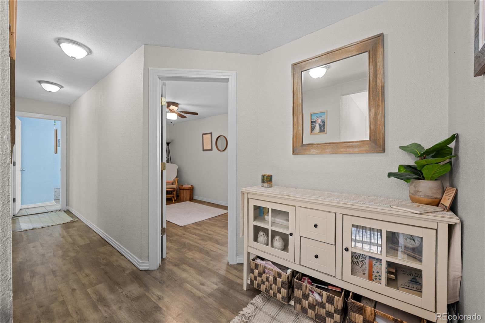 5211 Parmalee Gulch Road Indian Hills, CO 80454 - Photo 16 of 43 workspace with furniture and wooden floor