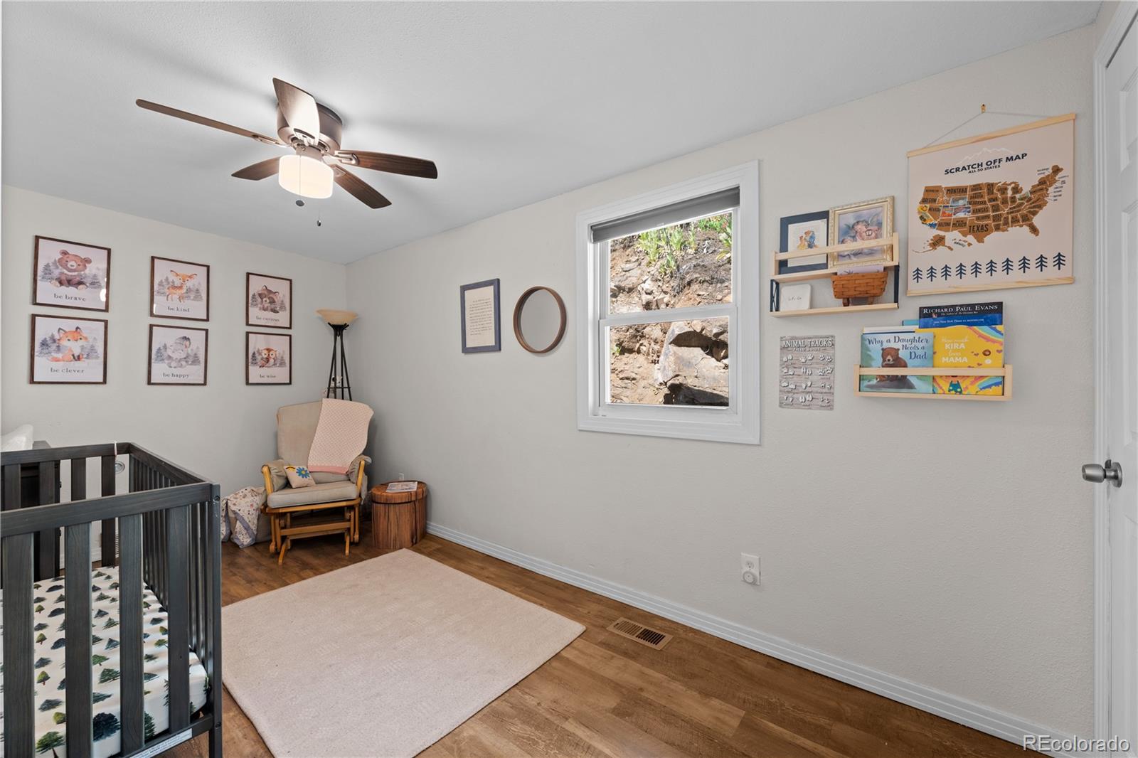 5211 Parmalee Gulch Road Indian Hills, CO 80454 - Photo 20 of 43 a room with furniture and a window