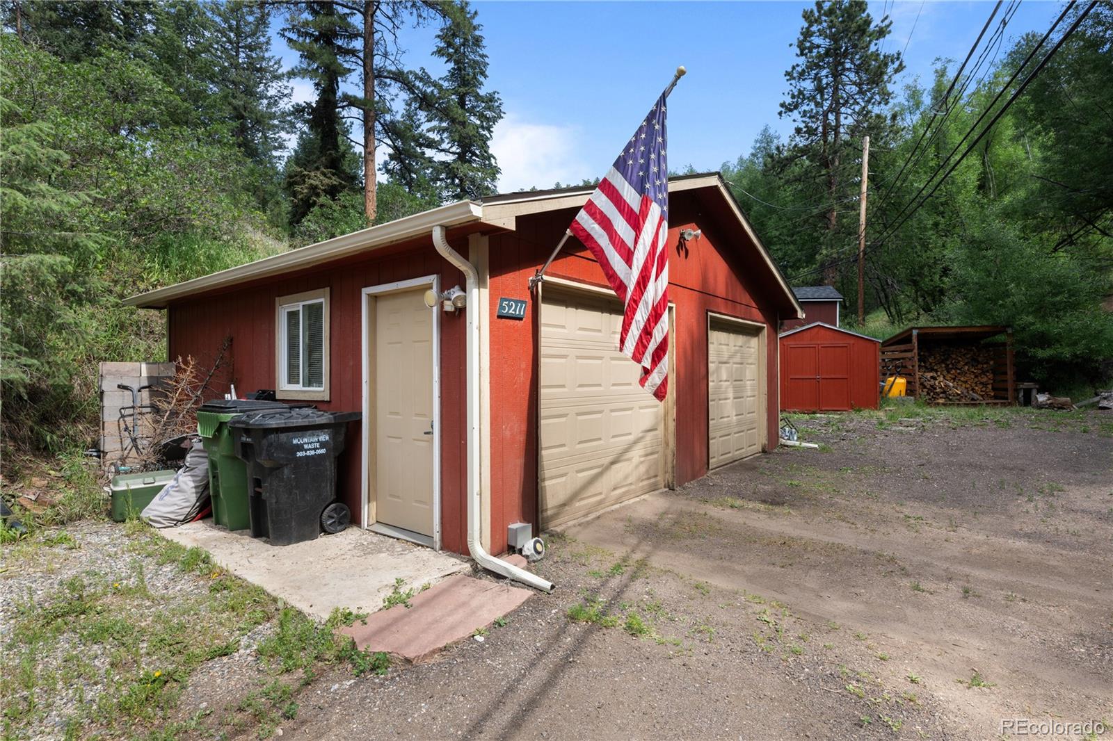 5211 Parmalee Gulch Road Indian Hills, CO 80454 - Photo 29 of 43 a view of backyard of house