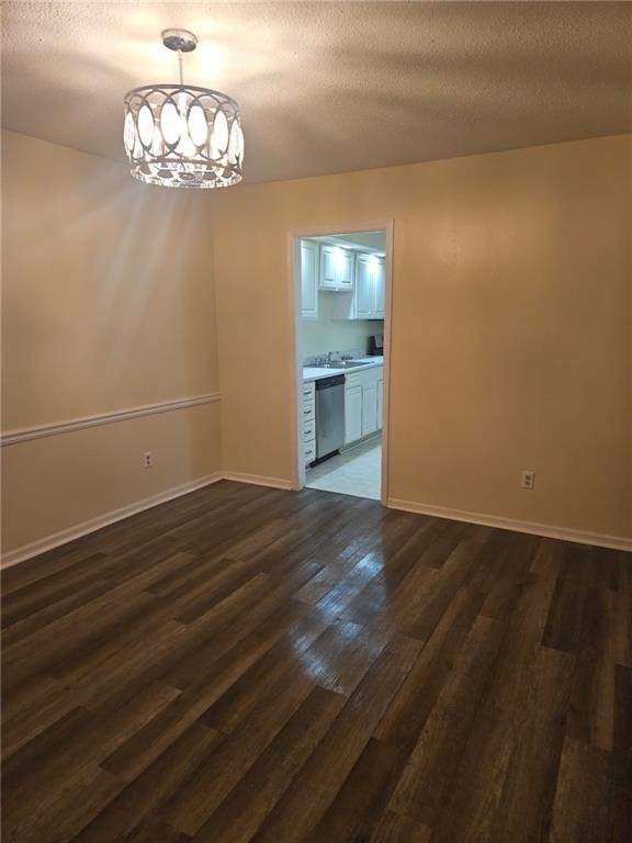 6851 Roswell Road, Unit I15 Atlanta, GA 30328 - Photo 16 of 29 a view of empty room with wooden floor