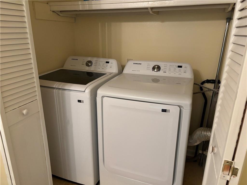6851 Roswell Road, Unit I15 Atlanta, GA 30328 - Photo 20 of 29 a utility room with dryer and washer