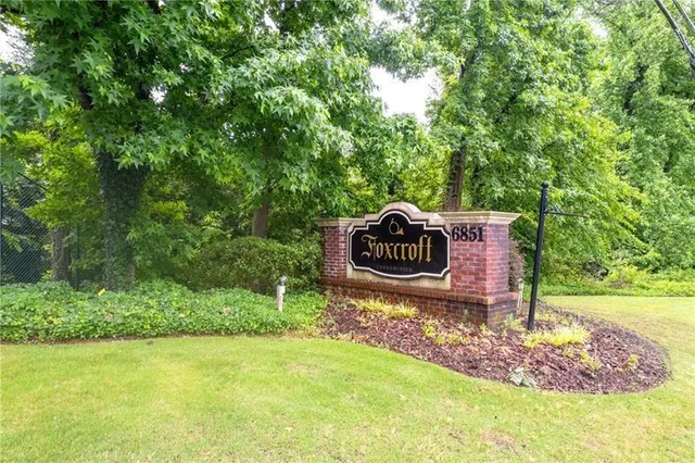 a sign that is on a brick wall