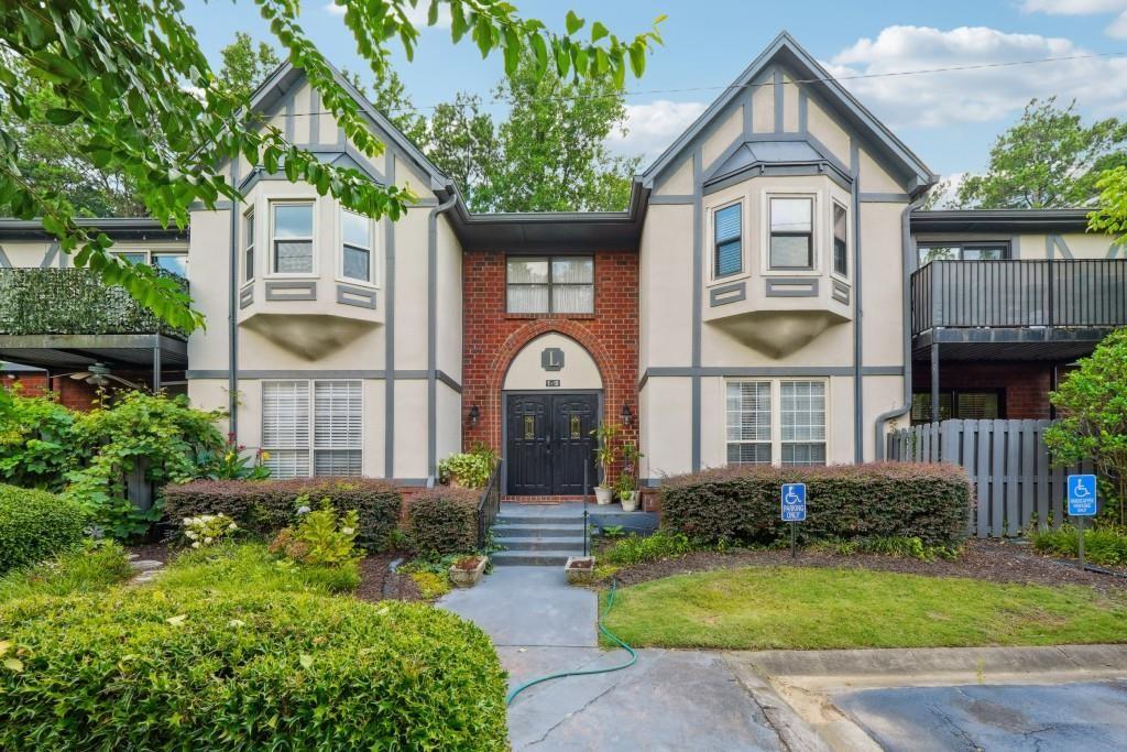 6851 Roswell Road, Unit I15 Atlanta, GA 30328 - Photo 3 of 29 a front view of a house with garden
