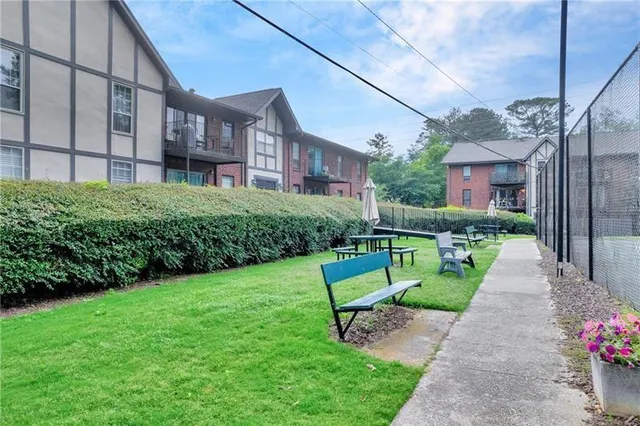 a sign board with yard in front of it