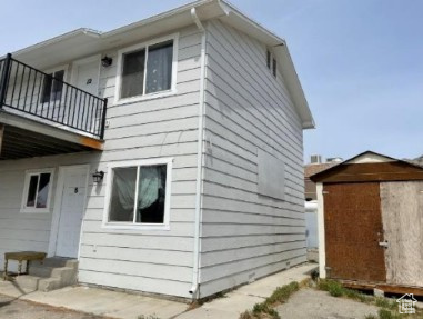 590 Pilot Avenue Wendover, UT 84083 - Photo 5 of 20 View of home's exterior with a balcony and a storage shed