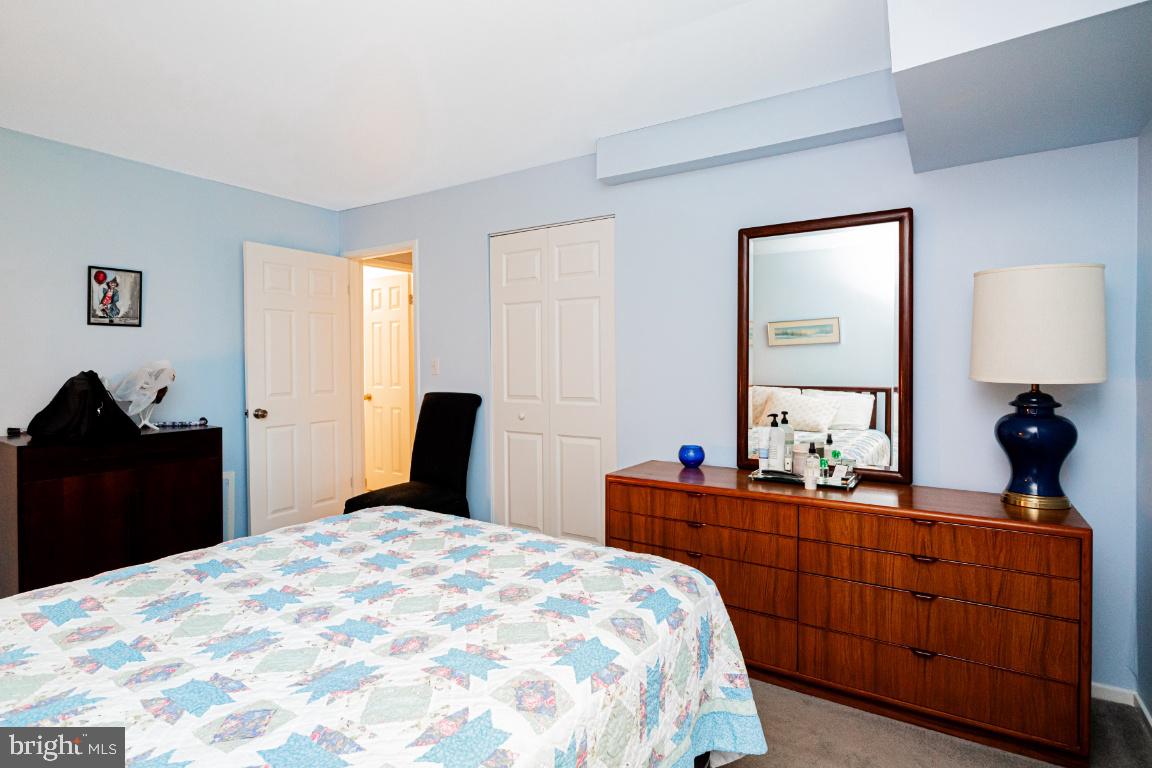 8705 Hayshed Lane, Unit 33 Columbia, MD 21045 - Photo 14 of 22 a bedroom with a bed and a dresser