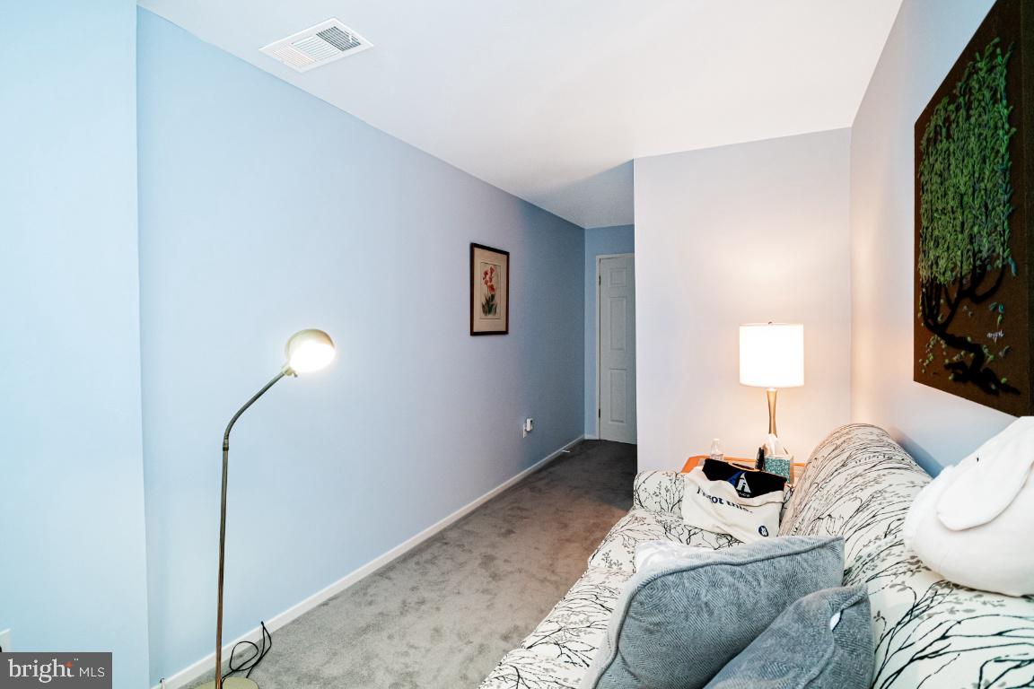 8705 Hayshed Lane, Unit 33 Columbia, MD 21045 - Photo 17 of 22 a bed room with a bed and a window