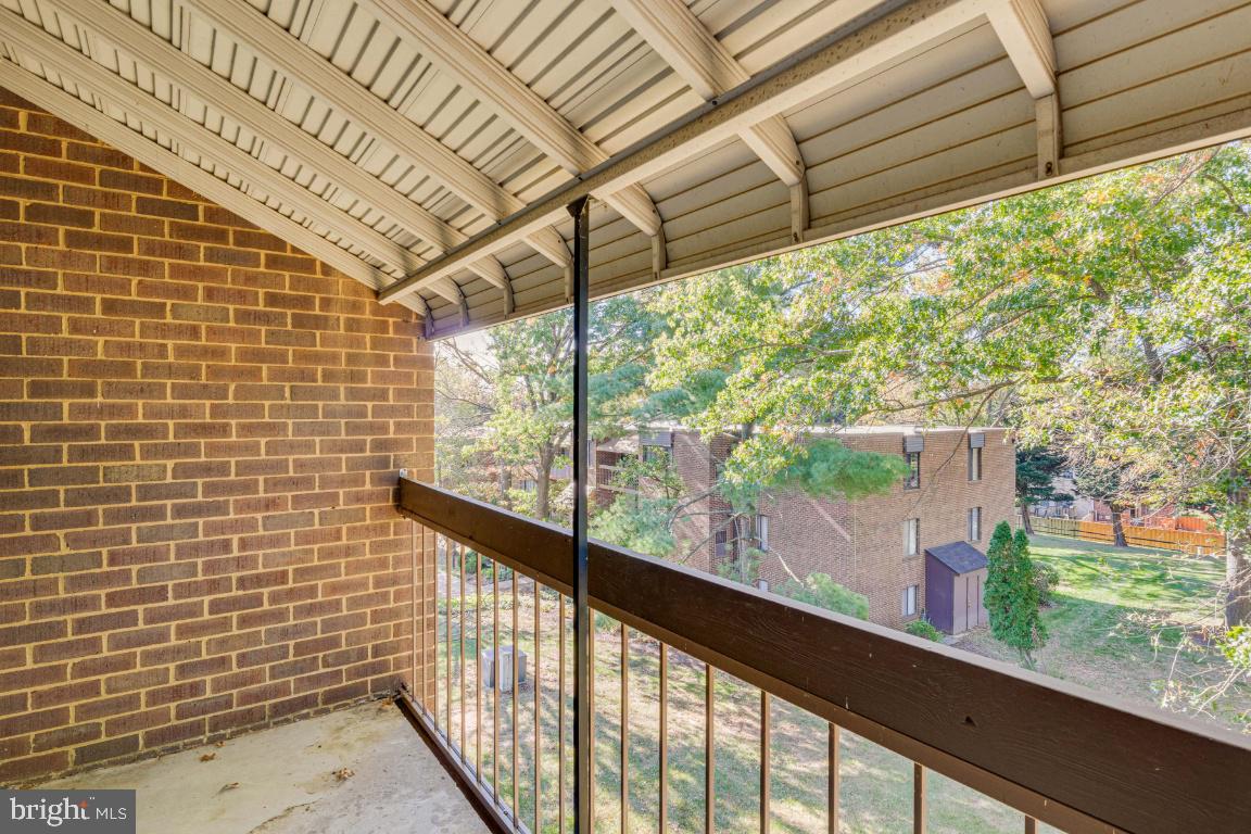 8705 Hayshed Lane, Unit 33 Columbia, MD 21045 - Photo 18 of 22 a view of a pathway with a porch