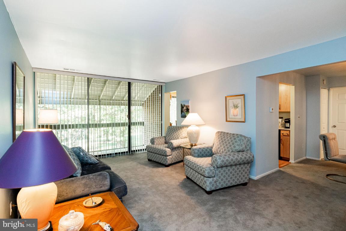 8705 Hayshed Lane, Unit 33 Columbia, MD 21045 - Photo 2 of 22 a living room with furniture and a large window
