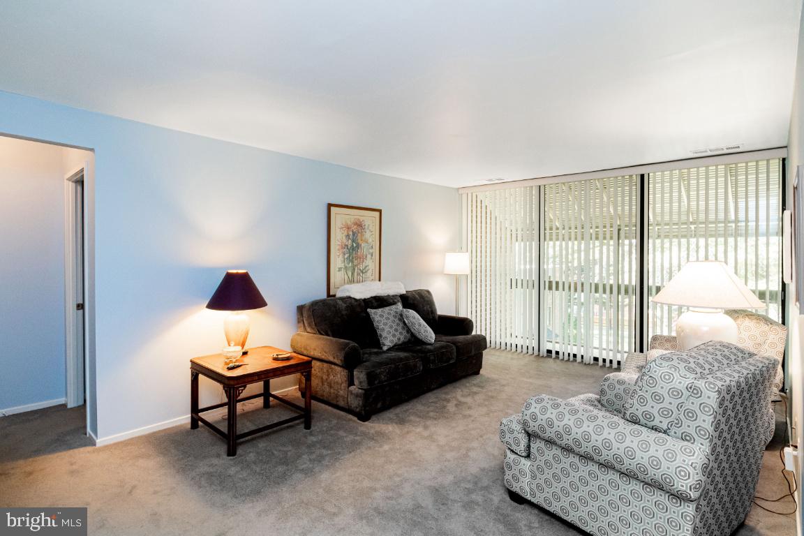 8705 Hayshed Lane, Unit 33 Columbia, MD 21045 - Photo 3 of 22 a living room with furniture and a large window