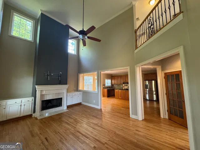 a view of a livingroom with a fireplace and window