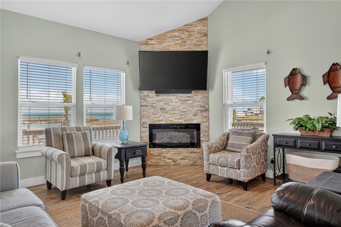 838 Rattlesnake Point Road Rockport, TX 78382 - Photo 11 of 40 a living room with furniture fireplace and flat screen tv