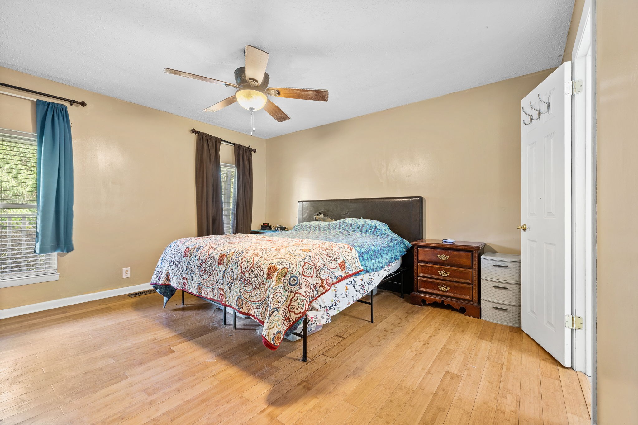 1165 Manley Loop Dickson, TN 37055 - Photo 13 of 29 a bedroom with a bed and wooden floor