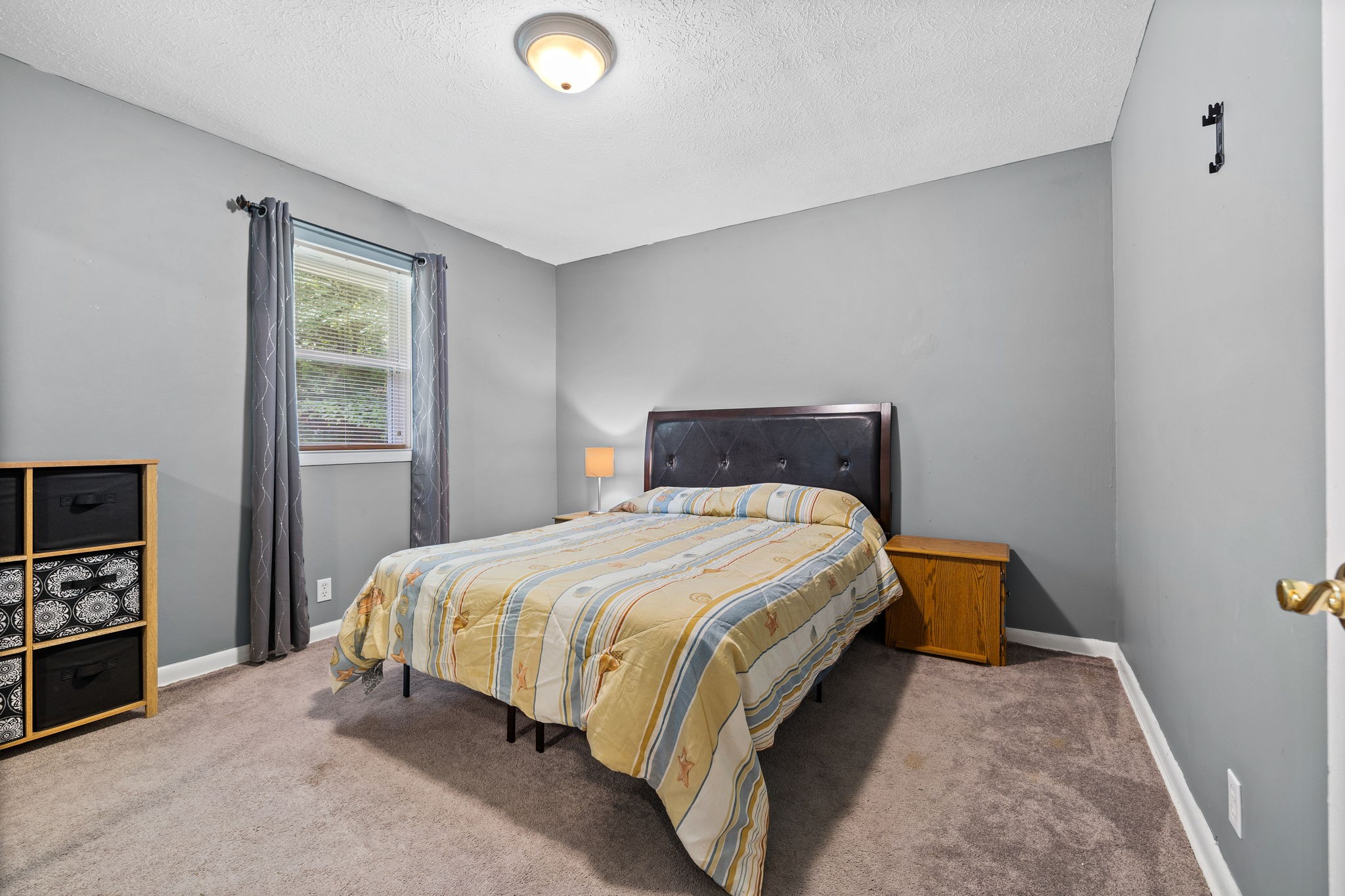 1165 Manley Loop Dickson, TN 37055 - Photo 16 of 29 a bedroom with a bed and a window