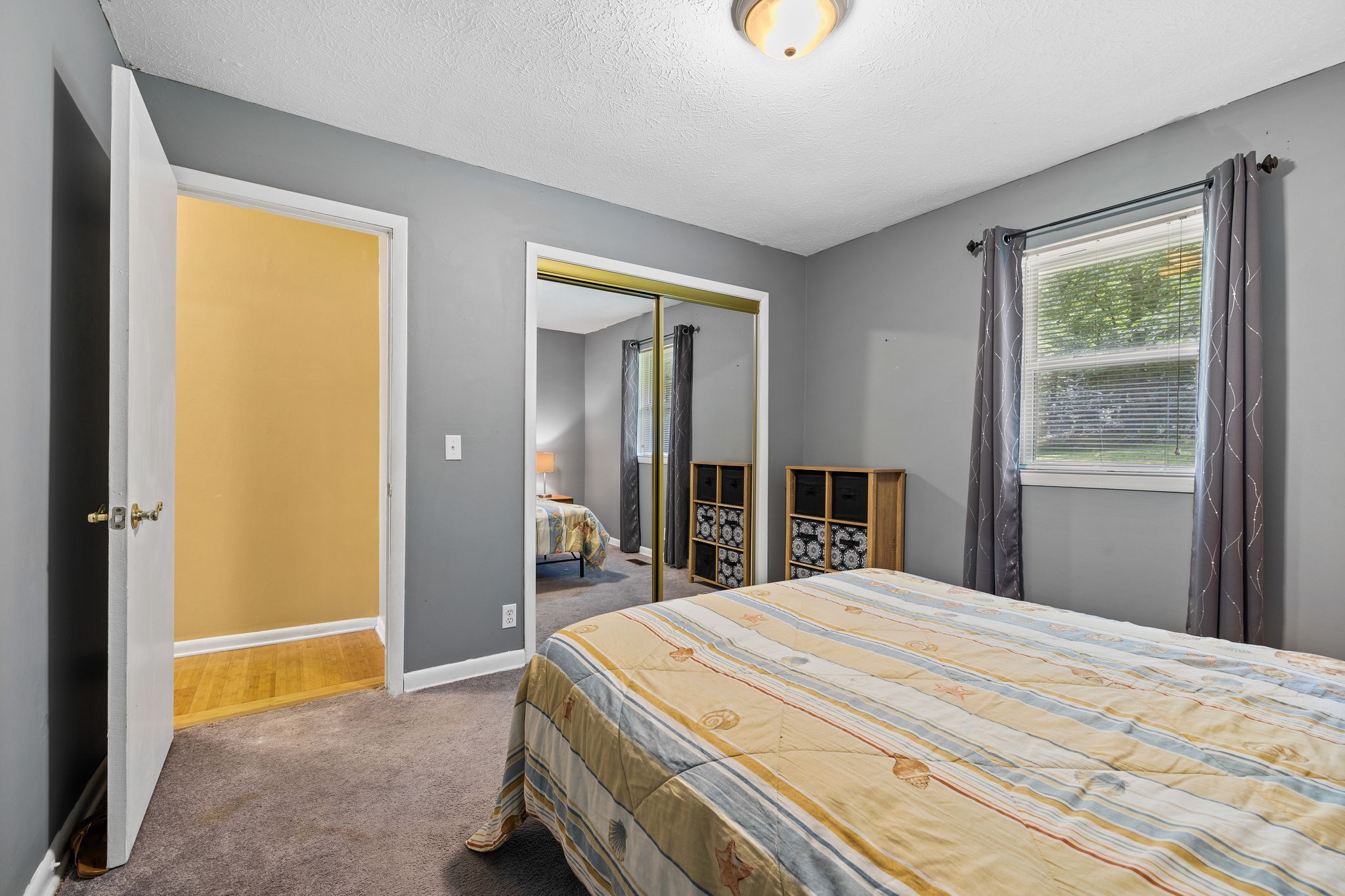 1165 Manley Loop Dickson, TN 37055 - Photo 17 of 29 a bed sitting in a bedroom next to a window