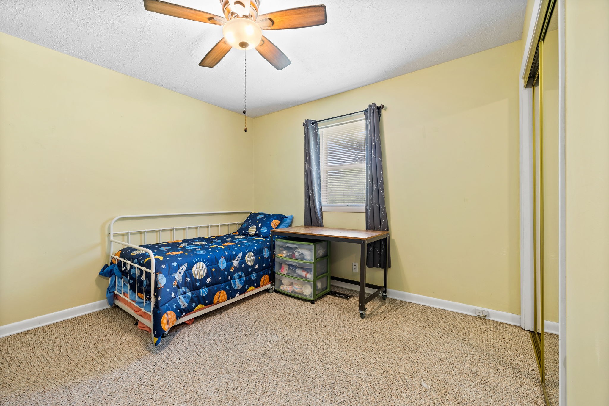 1165 Manley Loop Dickson, TN 37055 - Photo 18 of 29 a room with a bed and a chandelier