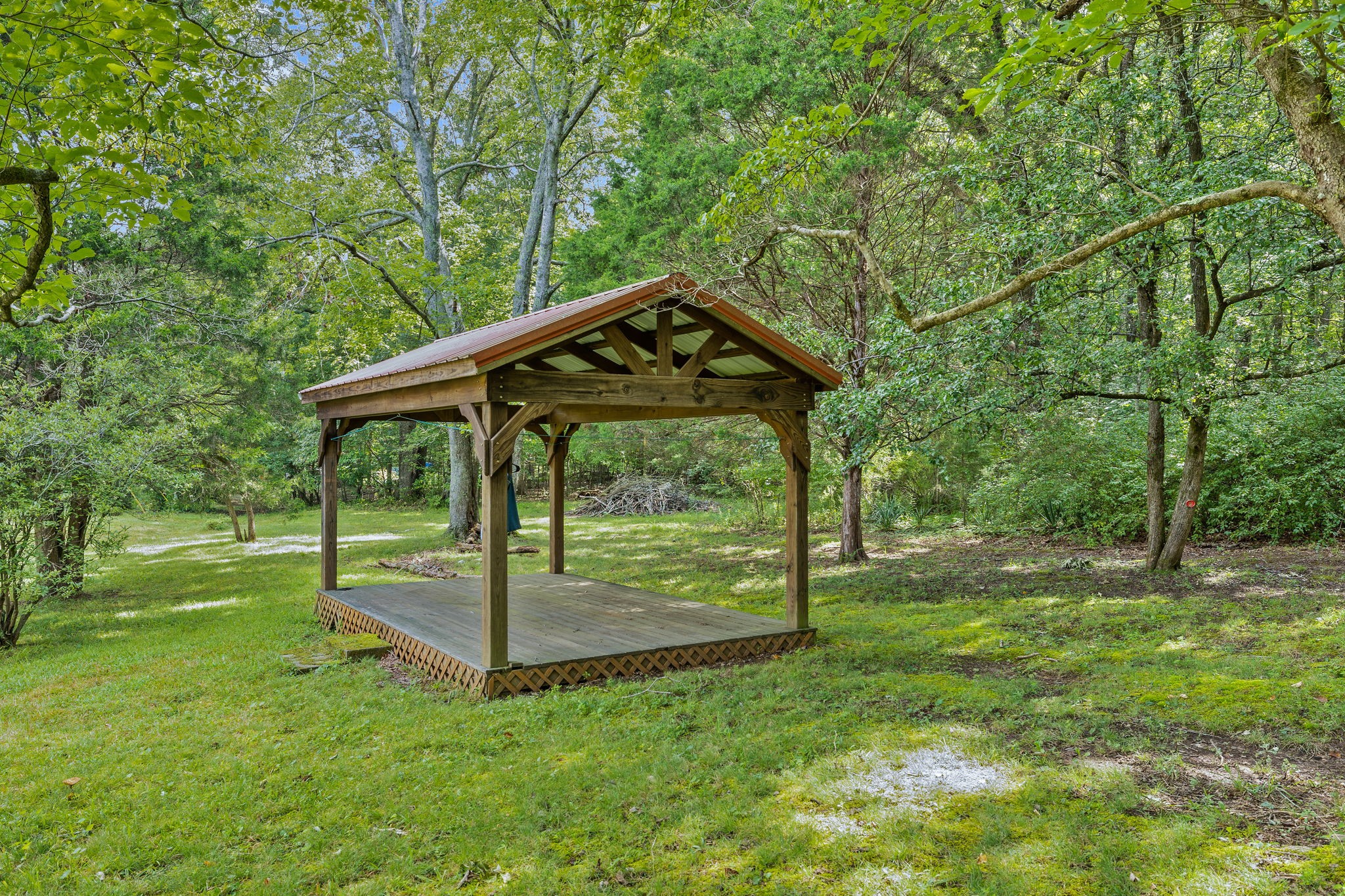1165 Manley Loop Dickson, TN 37055 - Photo 24 of 29 a backyard of a house with table and chairs