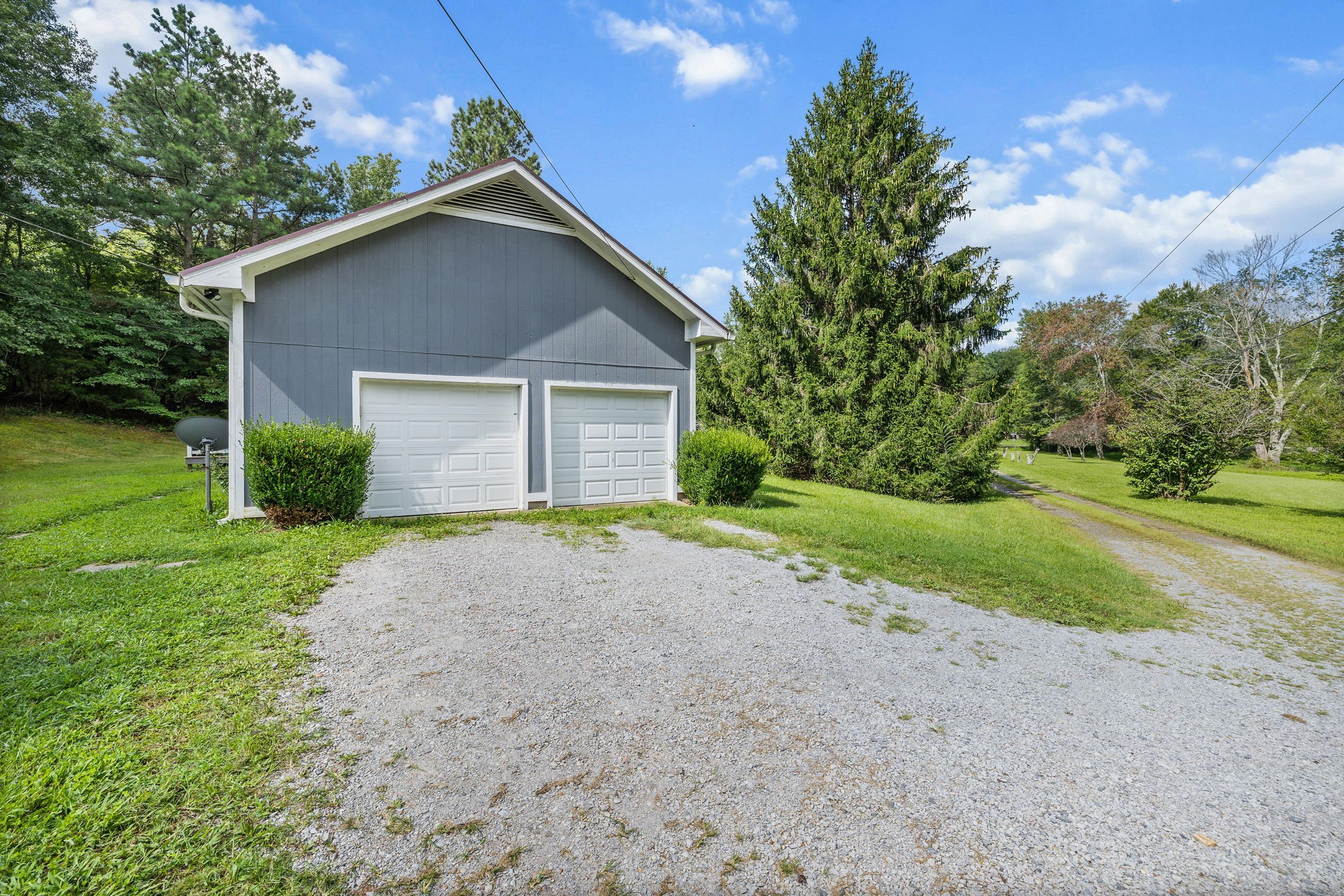 1165 Manley Loop Dickson, TN 37055 - Photo 25 of 29 a front view of house with yard and green space